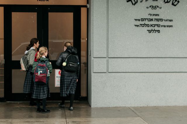 A group entering a yeshiva.